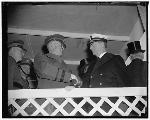Service chiefs review army day parade. Washington, D.C., April 6. Maj. Gen. Malin Craig, U.S. Chief of Staff, greets Rear Admiral William D. Leahy, Chief of Naval Operations, just before both reviewed with President Roosevelt today's Army Day Parade in the Capitol, 4/6/38