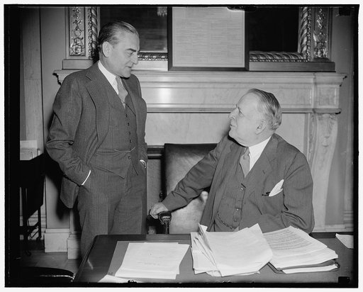 Senate Naval Affairs Committee hears Chief of Naval Aeronautics in secret session. Washington, D.C., April 7. Rear Admiral Arthur D. Cook, Chief Naval Aeronautics, pictured with Senator David I. Walsh, (left) Chairman of the Senate Naval Affairs Committee, before whom A.D. Cook appeared today in sec