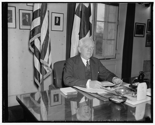 New head of American Red Cross. Washington, D.C., April 13. Norman H. Davis, of New York and Mr. Roosevelt's Ambassador at Large, has been appointed Chairman of the American Red Cross by President Roosevelt. Pictured at his desk at the Red Cross today when he assumed his duties, he succeeds the late