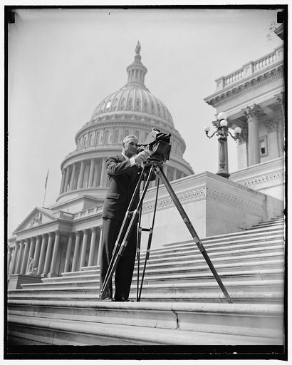 Sen. McAdoo with movie cameras at Capitol, 4/13/38. Golden State