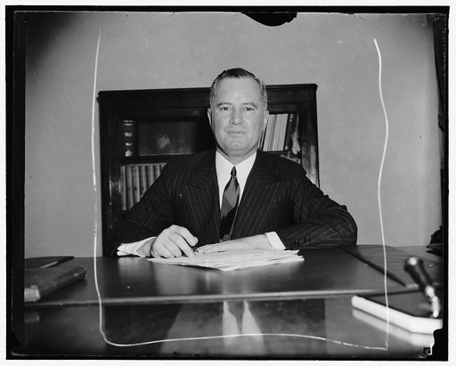New Assistant Commerce Secretary. Washington, D.C., May 13. Col. Richard C. Patterson, Jr., newly appointed Assistant Secretary of Commerce pictured at his desk shortly after taking the Oath of Office today. He succeeds Ernest Draper, who has been named to the Federal Reserve System, 5/13/38