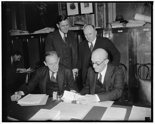 W.P.A. Administrator appears before Senate Appropriations Committee. Washington, D.C., May 17. Harry Hopkins, Chief of W.P.A. testified before the Senate Appropriations Committee today that approximately 2,800,000 persons are on relief. Shown with members of the committee, hopkins, left; seated Sen.