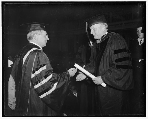 Montana receives honorary degree from American University. Washington, D.C., June 7. An honorary degree was conferred on Democratic anti-New Deal Senator Burton K. Wheeler, of Montana, by American University tonight. Dr. Joseph M. Gray, (left) Chancellor of the University is pictured conferring the 