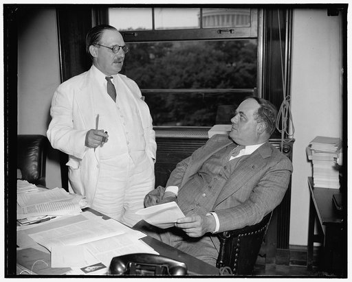 New and retiring tax experts. Washington, D.C., June 10. Lovell H. Parker, (left) Chief of Staff of the Joint Congressional Committee on Internal Revenue Taxation who resigned today, is pictured with is successor C.F. Stam. Stam has served the Committee since 1927, and, recently as counsel. Chairman