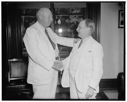 Tax expert resigns. Washington, D.C., June 11. Senator Pat Harrison (left) bids goodbye to Lovell H. Parker, who has resigned as Chief of Staff of the Joint Congressional Committee on Internal Revenue Taxation to enter private law practice. Senator Harrison, Senate Finance Committee Chairman, termed