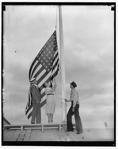 Rep. Nan Honeyman, of Ore., lowers flag at Capitol