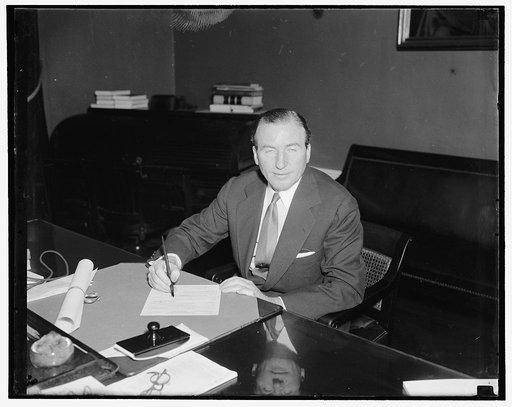 Assumes duties as Assistant Secretary of Treasury. Washington, D.C., July 1. John W. Hanes, Former New York broker and member of the S.E.C., as he assumed his duties today as the newly appointed Assistant Secretary of the Treasury. He succeeds Josephine Roche but will supervise government tax affari