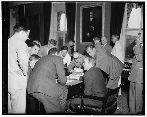 First press conference for new Assistant Secreary of the Treasury. Washington, D.C., July 1. Immediately after taking the oath as Assistant Secretary of the Treasury today, John W. Hanes, former New York broker and member of the S.E.C., held his first press conference. Hanes succeeds Josephine Roche