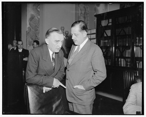 Monopoly huddle. Washington, D.C., July 1. Senator Joseph C. O'Mahoney (left) of Wyoming, named Chairman of the Congressional Monopoly Committee at their first meeting today, discusses with Thurman Arnold, Assistant Attorney, the legal aspects of the Monopoly Investigation which is designed to seter