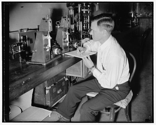 Government discovers method to preseve film. Folding endurance test, The flexibility is measured in this folding endurance tester. A strip of film is folded back and forth under tension until it breaks, and the number of folds it withstands is counted. Three types of films have been studied, termed 