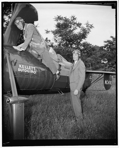 Sen. Theo Green, D. of Rhode Island, being assisted from his autogiro by John Miller