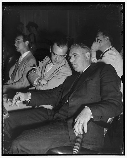 Last-Minute Advice. Washington, D.C., Aug. 1. Mayor Daniel A. Knaggs (right) of Monroe, Mich., gets last-minute advice from E.J. McCormick, legal counsel for city of Monroe, before taking the stand today at the Senate Civil Liberties Hearing. Knaggs told the Committee that special police sworn in fo