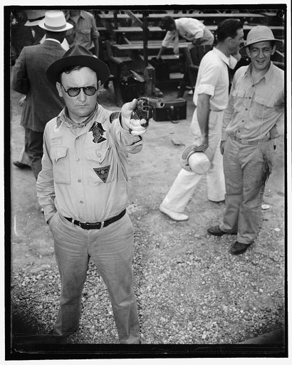 One of the Treasury's best marksmen. Washington, D.C., Aug. 2. L.E. Echols, of the Bureau of Customs, winner of last years fold medal in the annual marksmanship match between officers of the law enforcement services of the Treasury Dept. Tries cut his hand for the third annual match held in Washingt