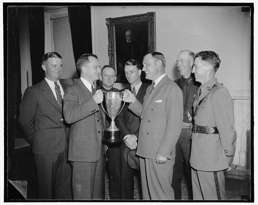 Custums rifle team receives secretary of treasury cup for marksmanship. Washington, D.C., Aug. 5. Acting Secretary of the Treasury, Roswell Magill today presented to the Bureau of Customs revolver team the silver cup offered by Secretary Morgenthau for proficiency in small-arms marksmanship by Treas