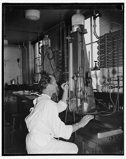 Add record depth reached by Navy divers. Lieut. A.R. Benhke [i.e. Albert R. Behnke], Medical Corps, U.S.N., uses the van slyke gas analysis apparatus in extracting gases from body fluids following the dives. Analysis of body fluid is made immediately after each diver comes from the water, 8/9/38