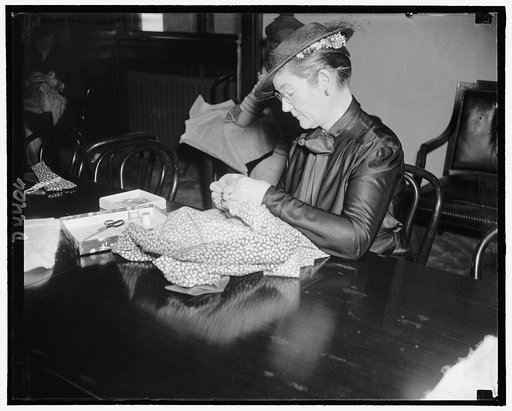 Mrs. Elbert Thomas, wife of the Senator from Utah, sewing for Red Cross at Senate Ladies Luncheon Club