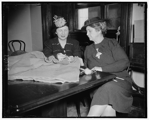 Mrs. H.H. Schwartz, wife of Senator from Wyo., checks over her knitting with Mrs. James Hughes, of Del. at Senate Ladies Luncheon Club