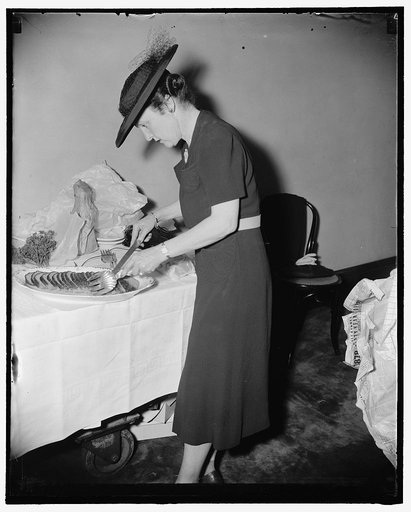 Mrs. Alvin Adams, wife of the Senator from Colorado preparing meat loaf for the Senate Ladies Luncheon Club