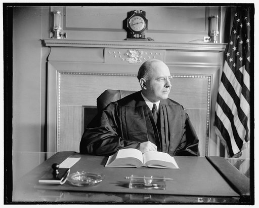 New Supreme Court Justice in robes. Washington, D.C., Jan. 29. The new Associate Justice of the United States Supreme Court, Stanley Reed, pictured in his robes for the first time since his confirmation. Warning to editors: