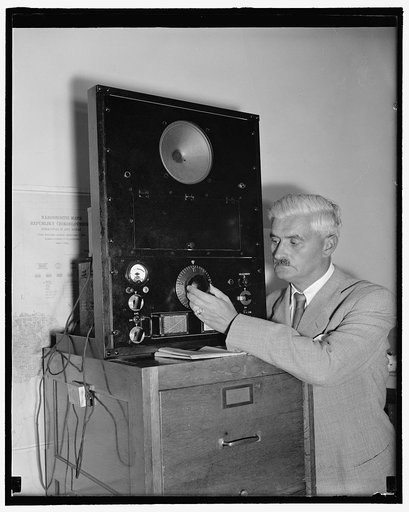Acting Czechoslovakian Minister listens to Hitler speech. Washington, D.C., Sept. 12. Dr. Karel Brejska, Charge d'Affaires and acting Minister in the absence of Minister Vladimir Hurban in Czechoslovakia, is pictured listening to Adolph Hitler's radio address today at the legation. He refused to com