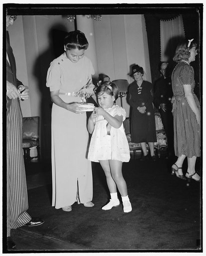 Washington's smallest diplomatic hostess. Washington, D.C., Sept. 21. As the new social season begins in Washington, little Didi Rajamaitri, Daughter of the Minister of Siam and Mme Abhibal Rajamaitri, continues to hold her unique place as one of the Capitol's smallest assistant hostesses. She is pi