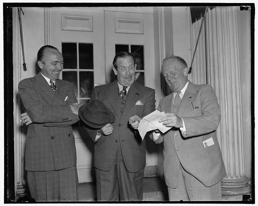 Left to right; George Durno, International News Service writer; Lew Lehr, movie comedian; Karl Godwin, Washington Times