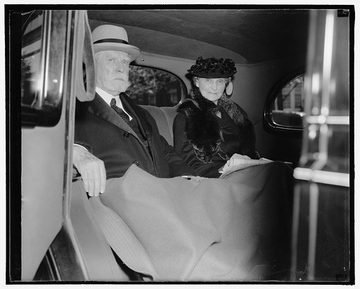 Chief Justice and Mrs. Hughes leave home for opening of Supreme Court. Washington, D.C., Oct. 3. Chief Justice and Mrs. Charles Evans Hughes leaving their home today for the United States Supreme Court where the Chief Justice presided at the court's opening for the 1938-39 term, 10/3/38