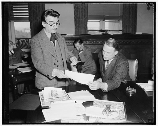 Anti-Fascist before the House Un-American Committee. Washington, D.C., Oct. 4. Girolano Valenti, Chairman of the Anti-Fascist Committee, showing Chairman Martin Dies, D. of Texas, information that Italian Consuls "spy and threaten" Italo-American citizens unsympathetic to Mussolini and have threaten