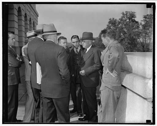 House Majority Leader gets ready for the opening of Congress. Washington, D.C., Oct. 19. Sam Rayburn, Majority Leader of the House, holds an informal press conference outdoors, Rayburn, one of the few congressional leaders to return to Washington before the sessions begin, gets to work at once on pu