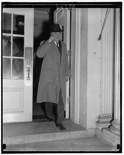 Wage-Hour Administrator reports to President. Washington, D.C., Oct. 25. Wage-Hour Administrator Elmer F. Andrews leaving the White House today after making a report to President Roosevelt. At a press conference today, Andrews expressed belief that employees thrown out of work by closing of low wage