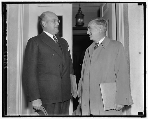 Asst. Secys of Army & Navy, Louis Johnson & Charles Edison leaving White House following conference with Pres. Roosevelt, Oct. 25, 1938