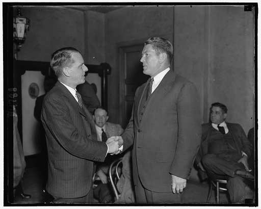 Former Heavyweight Champ congratulates New Liquor 'Czar' Washington, D.C., Oct. 25. Gene Tunney, right, former world's heavyweight champion and now an executive of the American Distillers Corp, greets Wesley A. Sturgis, newly named Executive Director of the Distilled Spirits Institute, as they met h