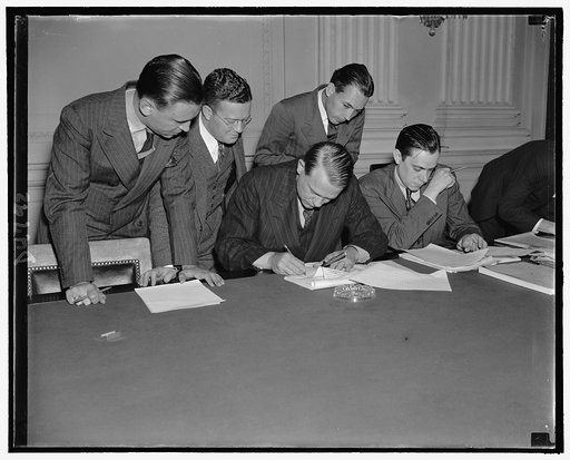 While newsmen take notes, Chairman Dies of House Committee investigating Un-American activities, proofs & reads his statement replying to Pres. Roosevelt's attack on the Committee, Oct. 26, 1938