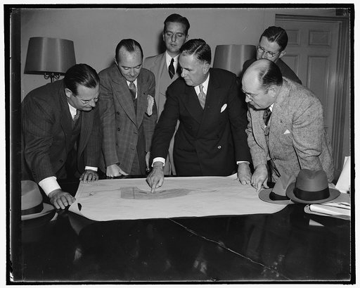 Washington gets a new airport. Washington, D.C., Oct. 27. After showing the President the plans for the new Gravely Point Airport, Chairman Edward J. Noble of the Civil Aeronautics Authority, center, and Col. Sumter Smith, Chairman of the Air Safety Board, right, explain to White house correspondent