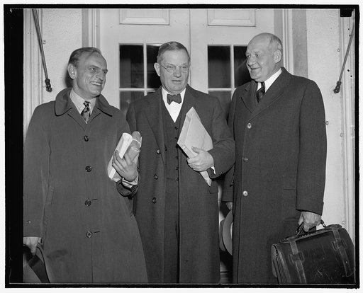 Fact finding board vetoes 15 percent rail wage cut. Washington, D.C., Oct. 29. Reporting to President Roosevelt today, the emergency fact-finding board announced they had rejected the demand of Railway Management for a 15 percent wage cut affecting 960,000 workers. Left to right - Dean James M. Land
