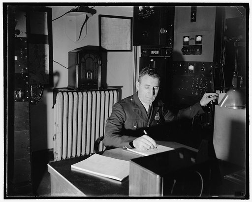 Alexander Friedberg, radio operator. He puts the dispatcher on the air for calls and is responsible for keeping the equipment in order, 10/38