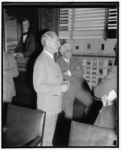 Pictured at Rail Labor-Management Meeting. Washington, D.C., Nov. 7. E.E. Norris, President of the Southern Railway, and Carl Gray, right, Chairman of the Board, Union Pacific, chat as the wait for the President's Special Railroad Committee to meet at the Southern Railway Office here today. The Comm