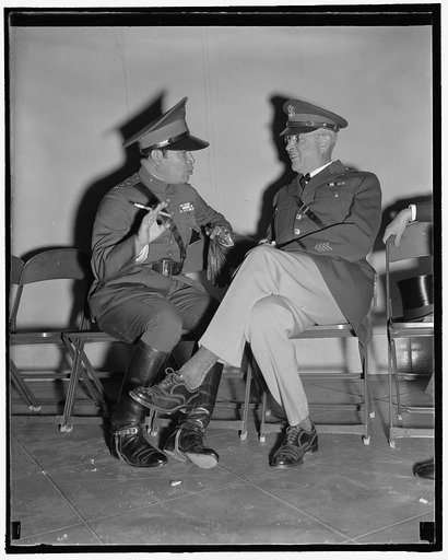 U.S. - Cuba military leaders. Washington, D.C., Nov. 11. No doubt armies were discussed when this picture was made today. Maj. General Malin Craig, U.S. Chief of Staff, and Col. Fulgencio Batista, Cuba's Dictator, as they chatted informally at Arlington while waiting for the arrival of President Roo