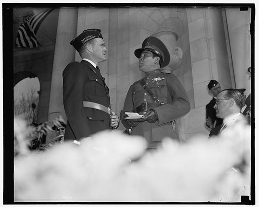 Greetings. Washington, D.C., Nov. 11. National Commander of the American Legion Stephen Chadwick, exchanges greetings with Cuba's Dictator Col. Fulgencio Batista at Armistice Day ceremonies at Arlington National Cemetery where the National paid homage to America's Unknown Soldier, 11/11/38