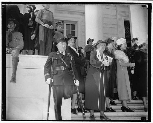 Touching contrast. Washington, D.C., Nov. 11. A contrast in emotion is this picture made while President Roosevelt paid tribute today to America's Unknown Soldier at Arlington Cemetery. While Alex Stern, World War veteran who lost a leg in the battle of Meuse-Argonne, remembers thoughtfully that the
