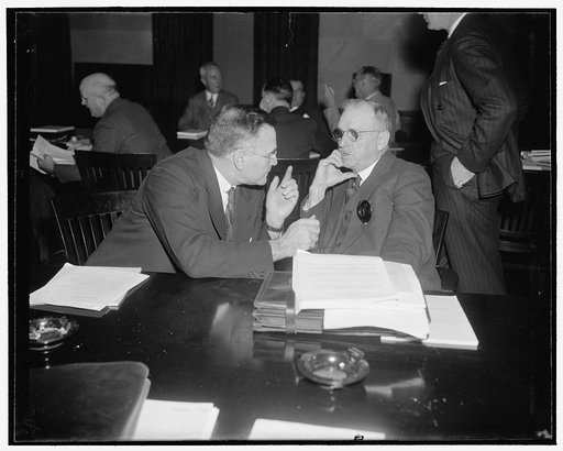 Listen in on transportation conference. Washington, D.C., Nov. 22. Fred I. Kent, Left, representing the American Bankers' Association, and Milton Harrison, financier, listen in on the Transportation Conference at the U.S. Chamber of Commerce today. To seek ways and means for solving the railroad's f