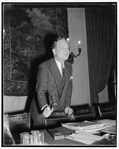 GOP chairman opens national committee meeting. Washington, D.C., Nov. 29. A victory meeting might be called the one today of the Republican National Committee at the Carlton Hotel here. Chairman John Hamilton is pictured calling the members to order, after which, gains made in the last election were