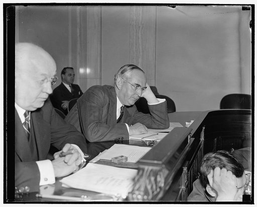 Michigan Senator attentive listener. Washington, D.C., Nov. 30- Senator Arthur M. Vandenberg of Michigan, Republican[?] member of the Senate Finance Subcommittee studying profit sharing systems, cups an attentive ear as he listens to witnesses at today's hearing