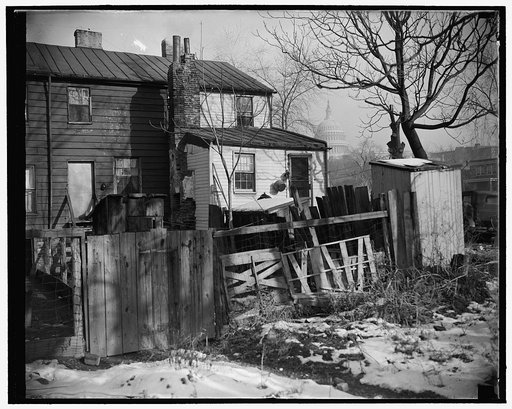 Capital slums to go under new low rent housing program. Washington, D.C., Nov. 30. Now that President Roosevelt has approved the $15,000,000 low rent housing program for the District of Columbia, such slum scenes as this will disappear from the 'city beautiful.' This picture was made within a stone'