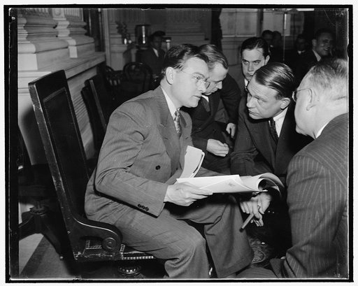 UAWU head quizzed by Rep. Dies. Washington, D.C., Dec. 1. Homer Martin, left, President of the Automobile Workers Union, as he was quizzed today by Rep. Martin Dies, Chairman of the House Committee Investigating Un-American Activities. Martin told the Committee that communists are active in both the