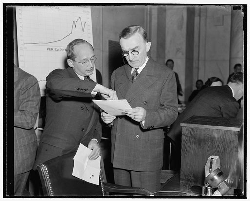As monopoly investigation opened. Washington, D.C., Dec. 1. First witness before the Joint Committee Investigating Monopolies today was Isador Lubin, left, Commissioner of Labor Statistics, U.S. Dept. of Labor, who is pictured with Senator Joseph C. O'Mahoney, Co-chairman of the Committee. Lubin tol