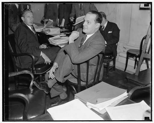 Washington, D.C., Dec. 3. Dr. Willard Thorp, Dun and Bradstreet Economist now with the Commerce Department, pictured as he listened to testimony before the Monopoly Committee today. He is a member of the Committee