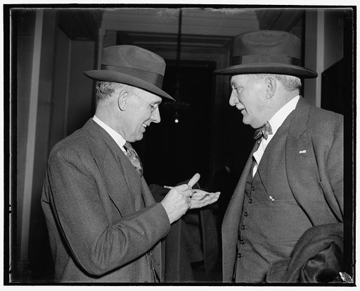 Knudson and Kettering after. Washington, D.C., Dec. 6. William S. Knudsen, right, President, and Charles F. Kettering, Vice President of the General Motors Corporation, compare notes as they arrived to appear before the Monopoly Committee today. Both testified that it would be 'bad for the industry 