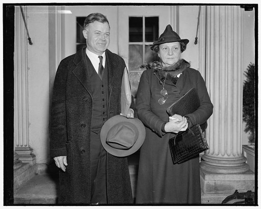 Confer with president. Washington, D.C., Dec. 6. Chairman J. Warren Madden of the National Labor Relations Board and Secretary of Labor Frances Perkins leaving the White [House][?] after discussing with President Roosevelt a labor dispute at the Merrimac Mills at Huntsville, Ala., which the Labor Se