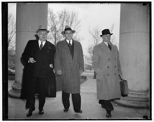 Charged with criminal conspiracy. Washington, D.C., Dec. 12. Nathan Silverman, surplus Army goods dealer, arriving at D.C., Supreme Court today where he went on trial with his brother, Joseph, and former Brig. Gen. Alexander E. Williams, on charges of conspiracy. They are accused of conspiring to pr